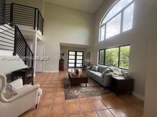18163 Southwest 149th Place Miami, FL 33187 - Photo 5 of 49 a living room with furniture and a large window