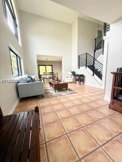 18163 Southwest 149th Place Miami, FL 33187 - Photo 9 of 49 a living room with furniture and a flat screen tv