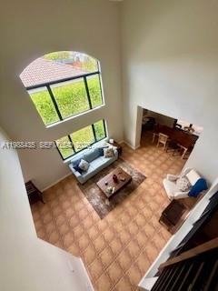 18163 Southwest 149th Place Miami, FL 33187 - Photo 10 of 49 a living room with a bed and a table