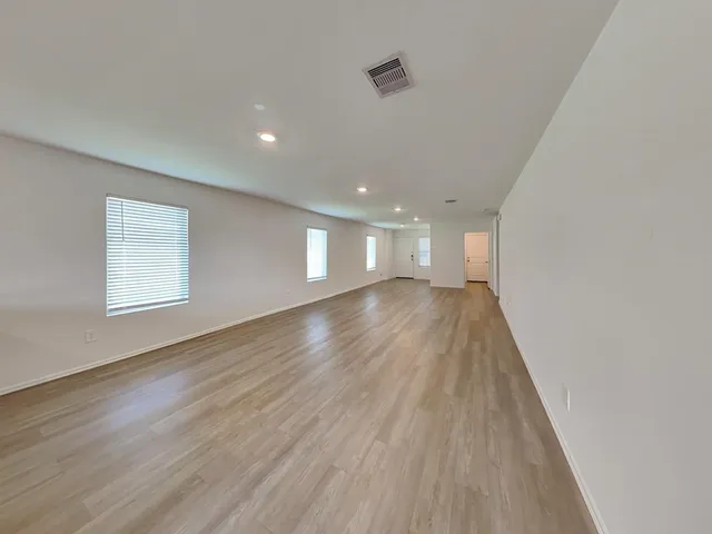 a kitchen with stainless steel appliances a stove microwave and sink