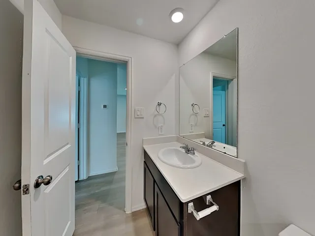 a front view of a house with yard and garage