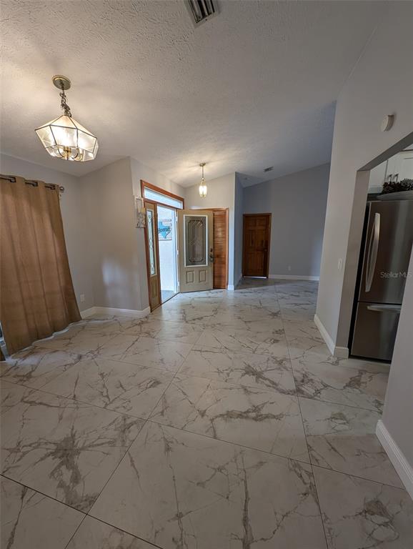 2106 Whitlock Place Dover, FL 33527 - Photo 11 of 83 a view of a livingroom with a stove