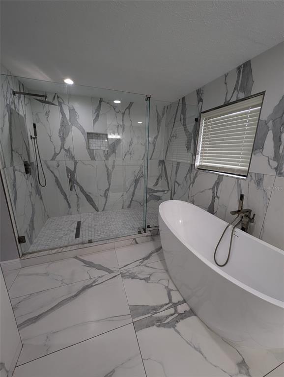 2106 Whitlock Place Dover, FL 33527 - Photo 34 of 83 a bathroom with a sink a toilet and bathtub