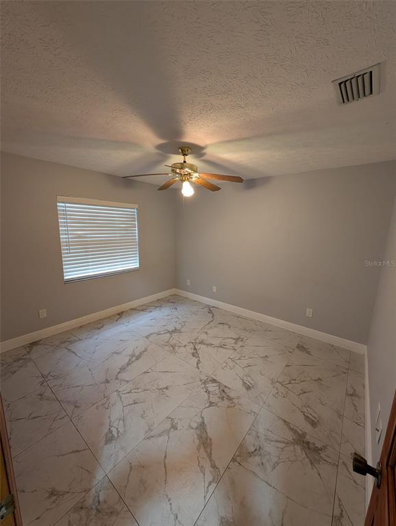 2106 Whitlock Place Dover, FL 33527 - Photo 45 of 83 a view of a livingroom with a chandelier fan