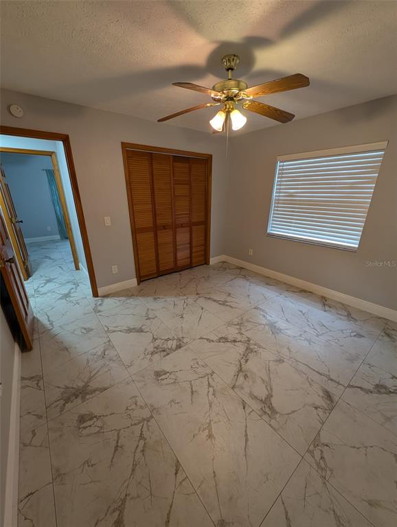 2106 Whitlock Place Dover, FL 33527 - Photo 46 of 83 a view of a livingroom with a ceiling fan and window
