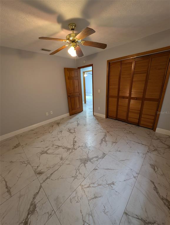 2106 Whitlock Place Dover, FL 33527 - Photo 47 of 83 a view of an empty room with a chandelier fan