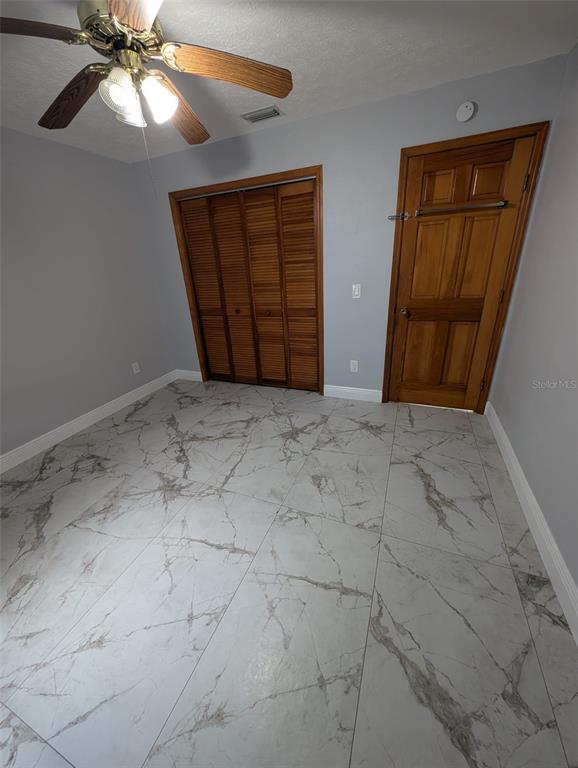 2106 Whitlock Place Dover, FL 33527 - Photo 50 of 83 a view of an empty room with closet and a window