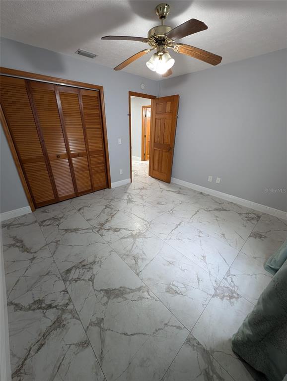 2106 Whitlock Place Dover, FL 33527 - Photo 52 of 83 a view of a livingroom with a ceiling fan and window