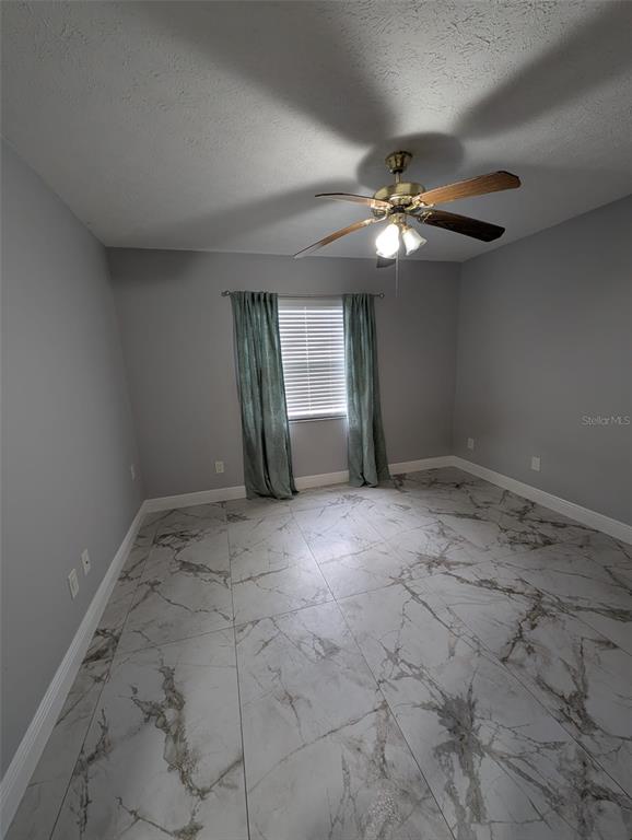 2106 Whitlock Place Dover, FL 33527 - Photo 53 of 83 a view of an empty room with a window