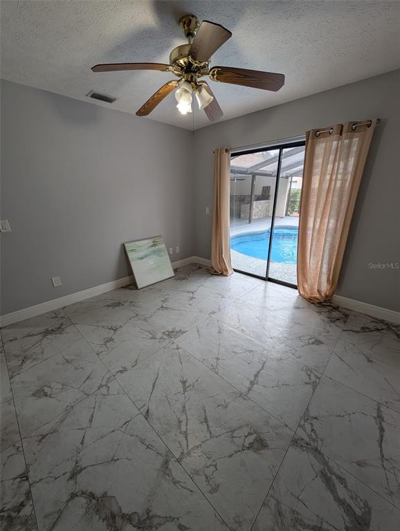 2106 Whitlock Place Dover, FL 33527 - Photo 54 of 83 a view of an empty room with a window