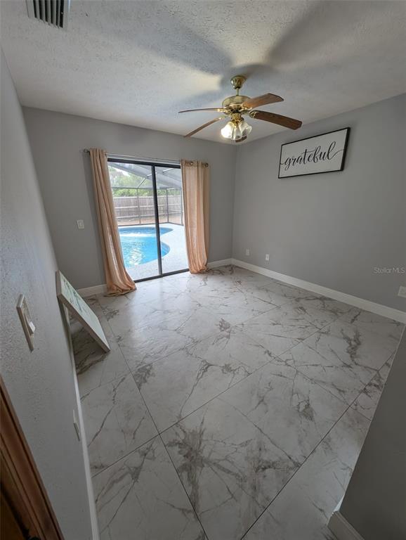 2106 Whitlock Place Dover, FL 33527 - Photo 55 of 83 a view of an empty room with a window