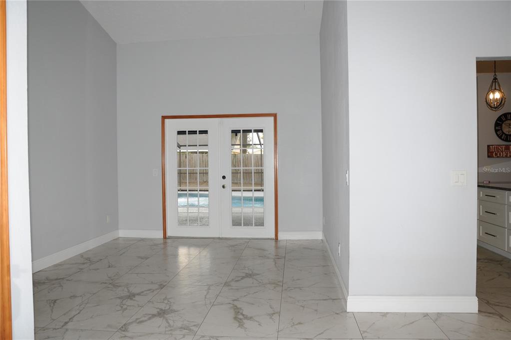 2106 Whitlock Place Dover, FL 33527 - Photo 9 of 83 a view of an empty room with glass door