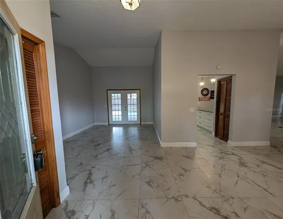 a kitchen with stainless steel appliances granite countertop a sink a stove and cabinets