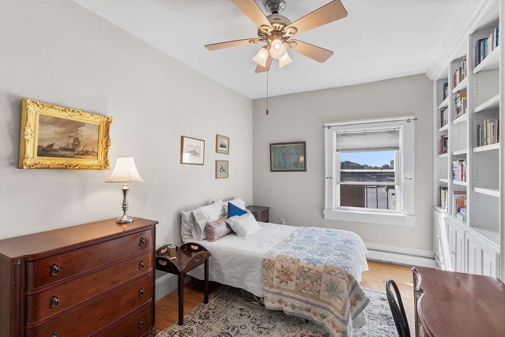 33 Hancock Street, Unit 4 Boston, MA 02114 - Photo 15 of 29 a bedroom with a bed and wooden floor