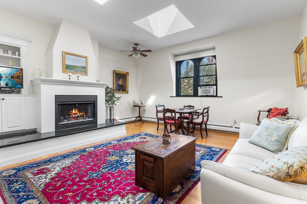33 Hancock Street, Unit 4 Boston, MA 02114 - Photo 4 of 29 a living room with furniture and a fireplace