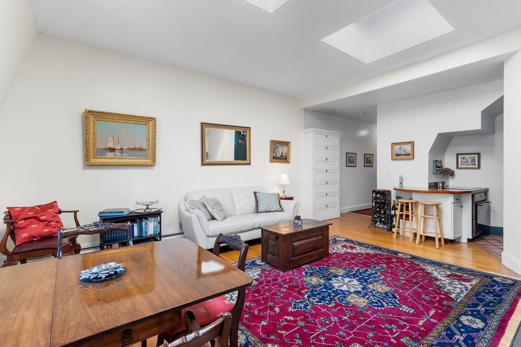 33 Hancock Street, Unit 4 Boston, MA 02114 - Photo 8 of 29 a living room with furniture and a table