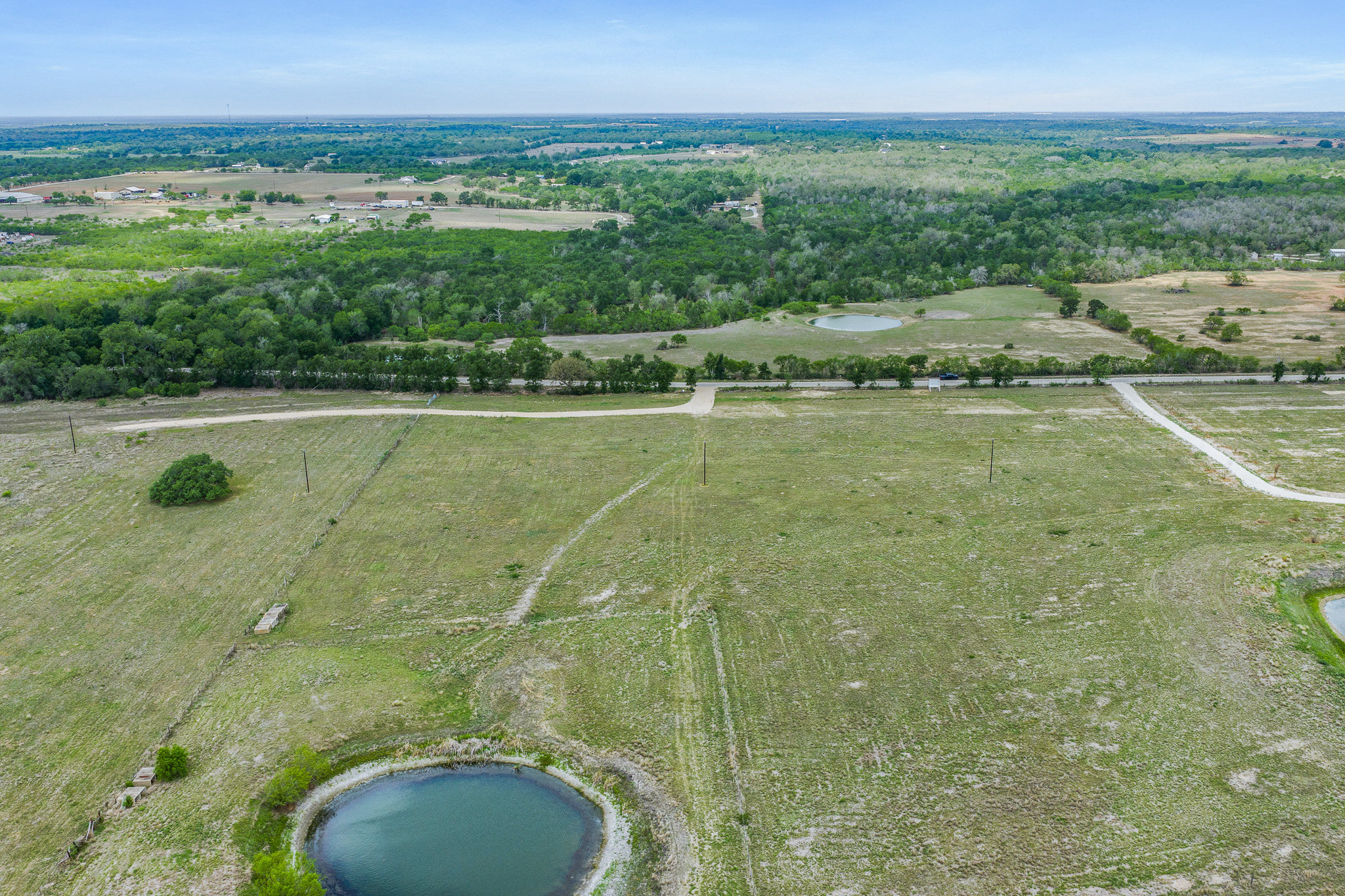 Tbd Lot 30 Tbd Road Lockhart, TX 78644 - Photo 5 of 6 Sprawling acreage with a private pond offers a canvas for a custom estate or agricultural pursuits.