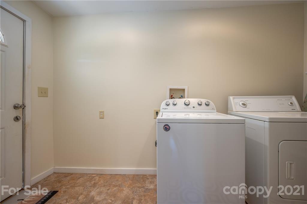 455 Sandy Plains Road Tryon, NC 28782 - Photo 21 of 28 a utility room with dryer and washer