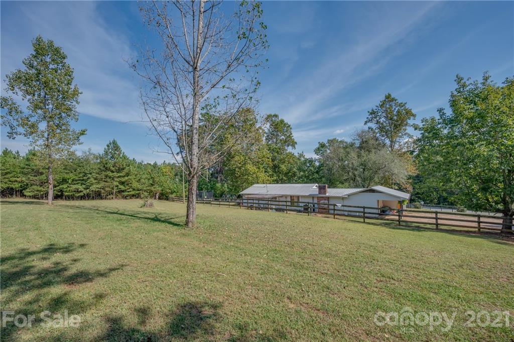 455 Sandy Plains Road Tryon, NC 28782 - Photo 5 of 28 a view of a lake with a yard