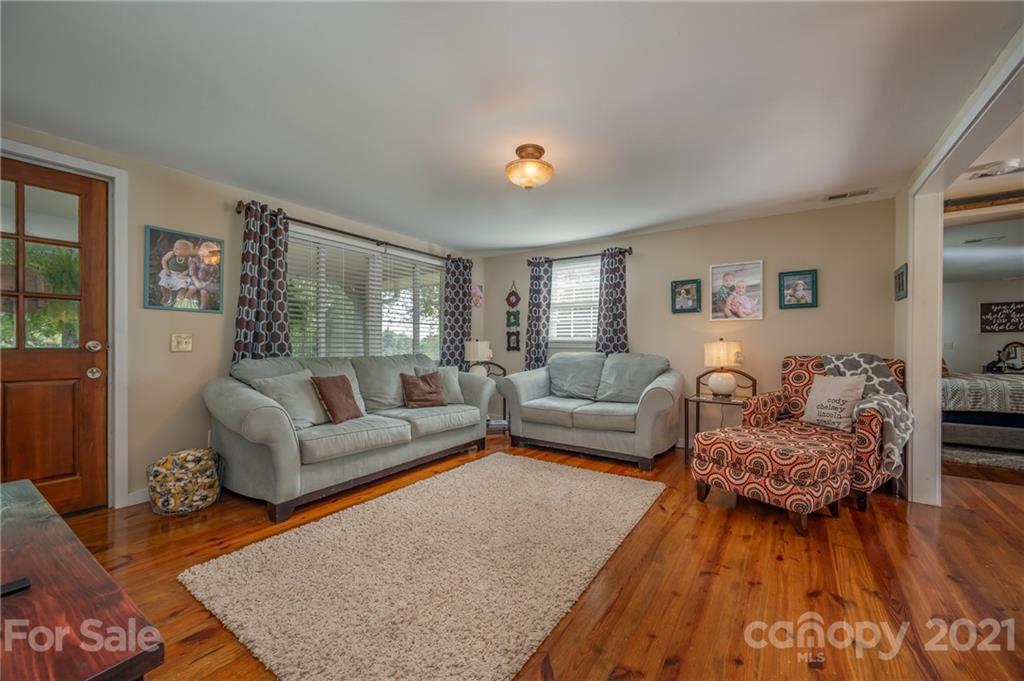 455 Sandy Plains Road Tryon, NC 28782 - Photo 7 of 28 a living room with furniture and wooden floor
