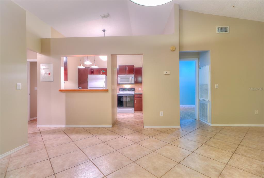 5100 Burchette Road, Unit 1607 Tampa, FL 33647 - Photo 12 of 39 an empty room with a cabinet and mirrors