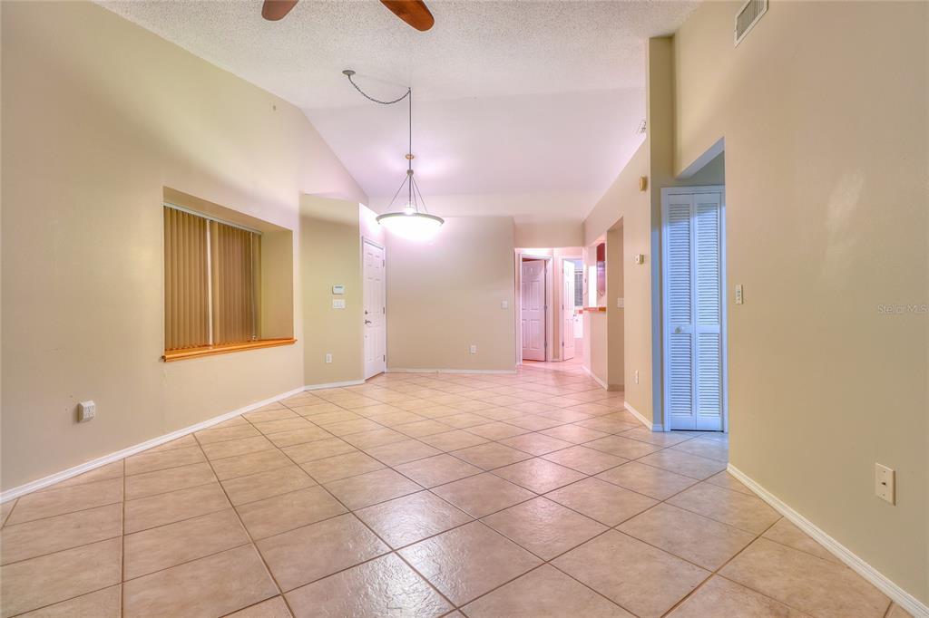 5100 Burchette Road, Unit 1607 Tampa, FL 33647 - Photo 14 of 39 a view of an empty room with a chandelier fan