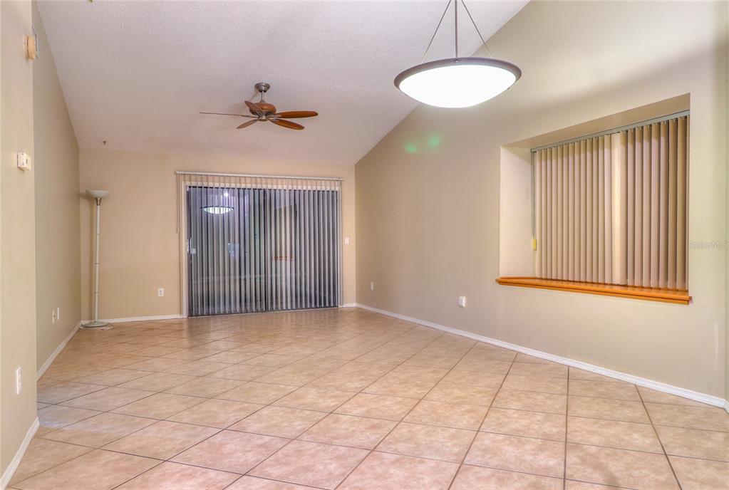 5100 Burchette Road, Unit 1607 Tampa, FL 33647 - Photo 15 of 39 an empty room with windows and fan