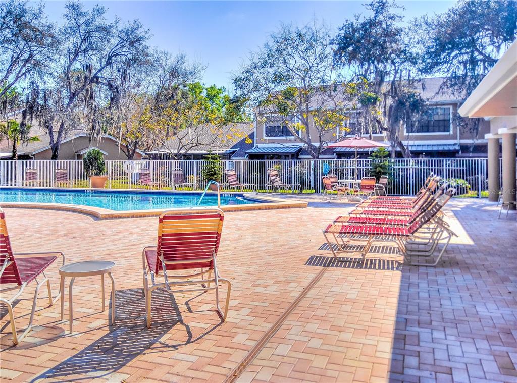 5100 Burchette Road, Unit 1607 Tampa, FL 33647 - Photo 2 of 39 a wooden bench sitting on top of a building