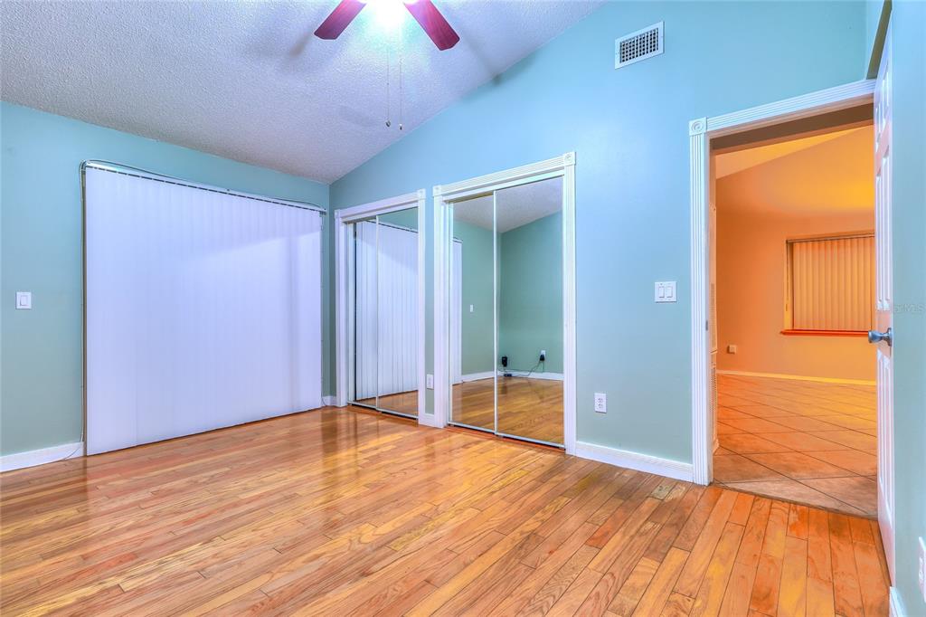 5100 Burchette Road, Unit 1607 Tampa, FL 33647 - Photo 25 of 39 a view of an empty room with wooden floor