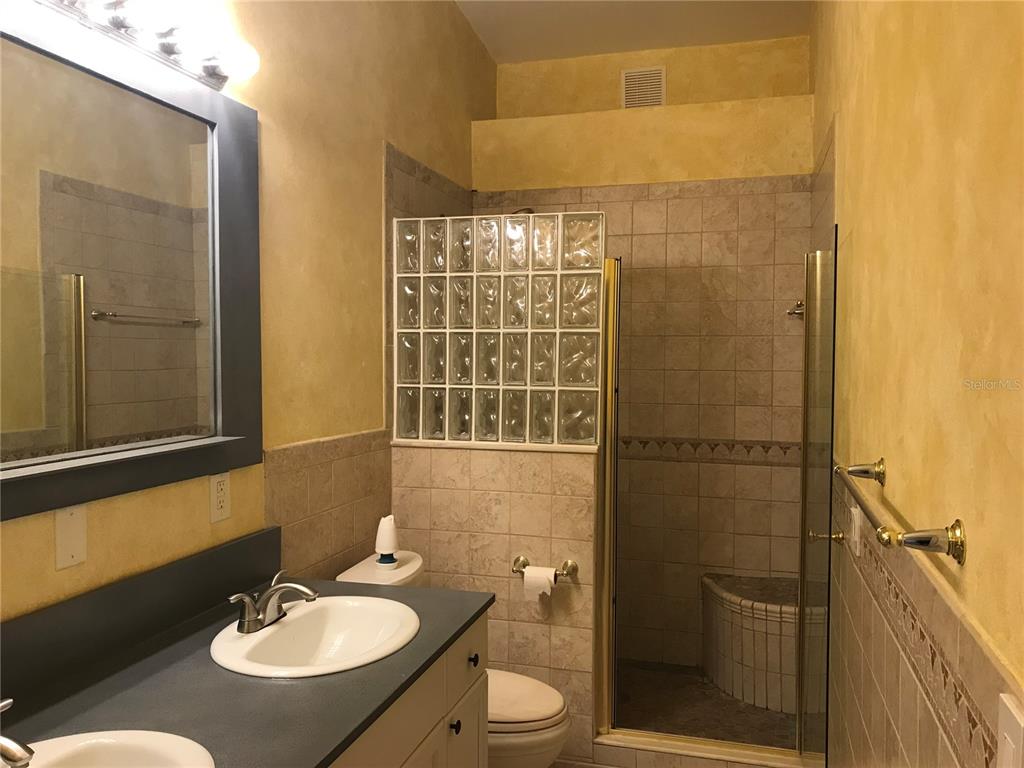 5100 Burchette Road, Unit 1607 Tampa, FL 33647 - Photo 30 of 39 a bathroom with a sink toilet and shower