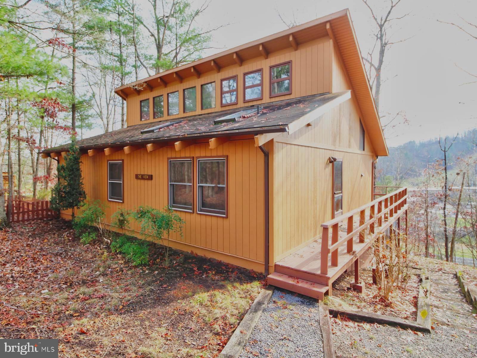 416 Killmon Road Basye, VA 22810 - Photo 1 of 31 FRONT VIEW WITH LARGE WRAP AROUND ROUND DECK
