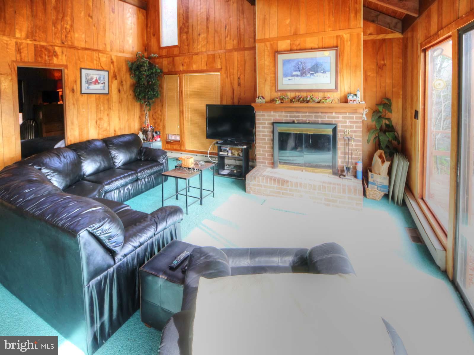 416 Killmon Road Basye, VA 22810 - Photo 9 of 31 LARGE GREAT ROOM WITH WOOD BURNING FIREPLACE