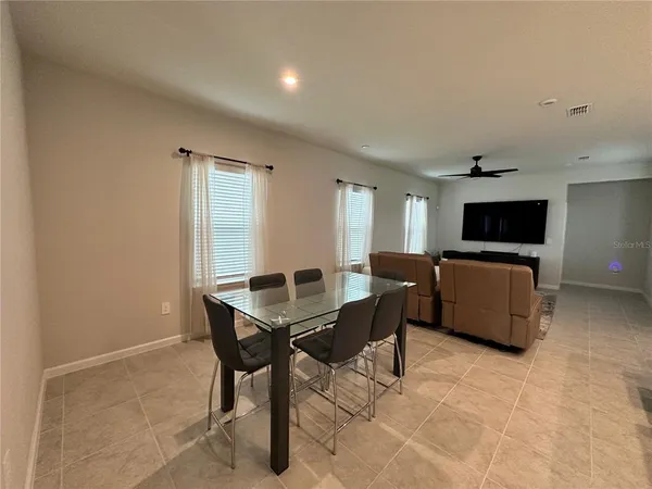 a view of a room with furniture window and wooden floor