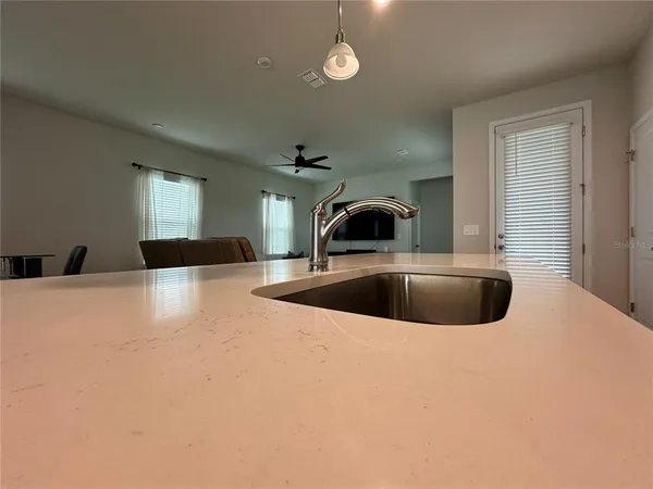 a bathroom with a sink toilet and mirror