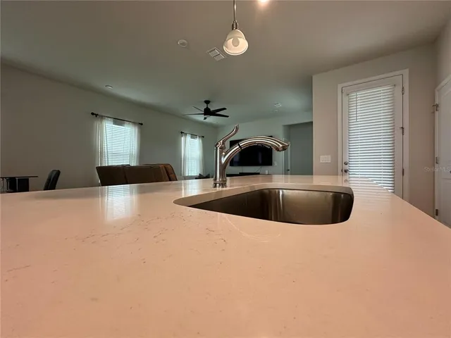 a bathroom with a sink toilet and mirror