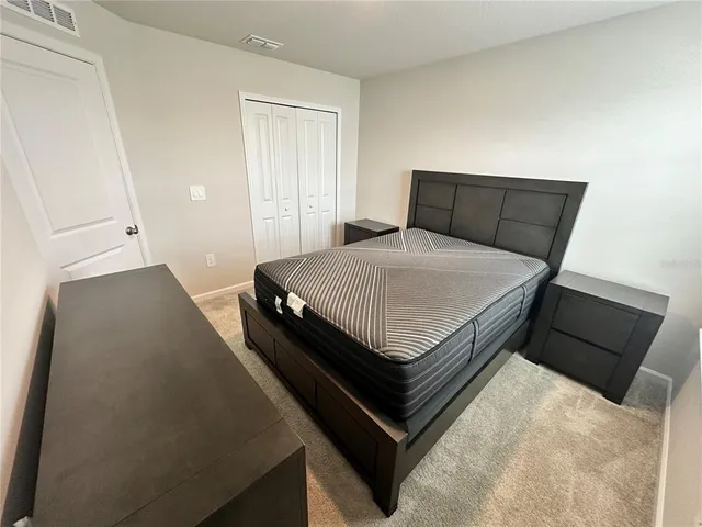 a bathroom with a sink a toilet and shower curtain
