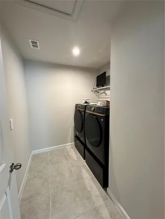 a room with furniture and a large window