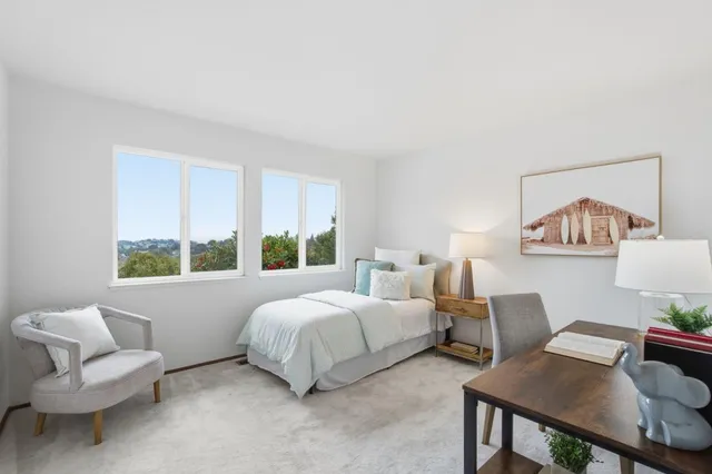 a bedroom with a bed and a window