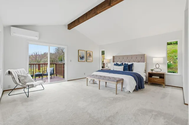 a bathroom with a granite countertop sink a mirror a vanity and a bathtub