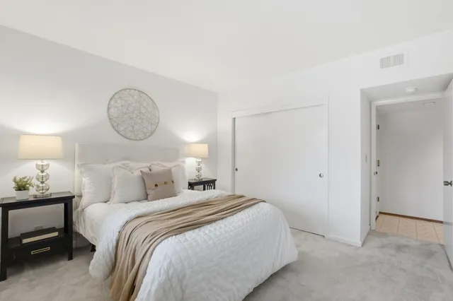 a view of a patio with table and chairs and potted plants