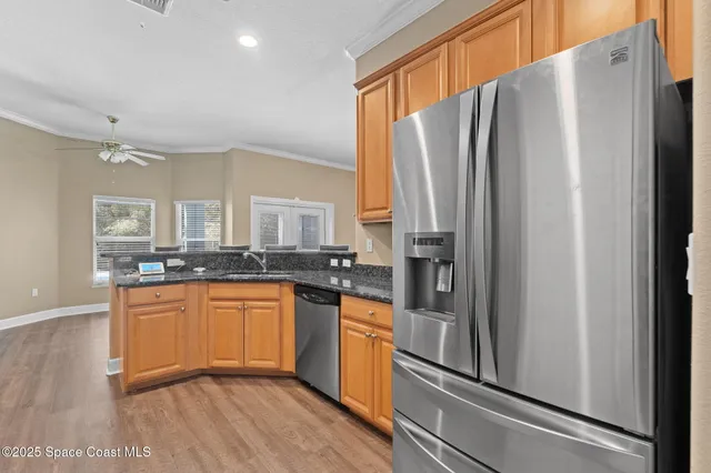 a white toilet sitting next to a white wall