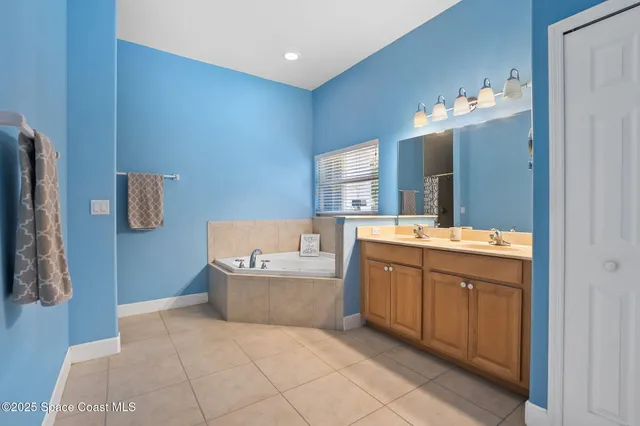 a bathroom with a sink a vanity and a mirror