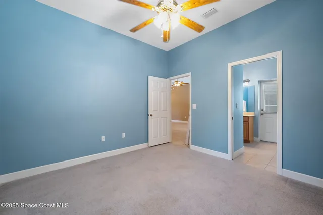 a bathroom with a sink a toilet and shower curtain
