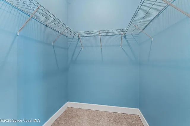 an aerial view of a house with a garden