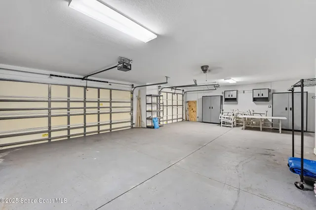 an aerial view of residential houses with trees