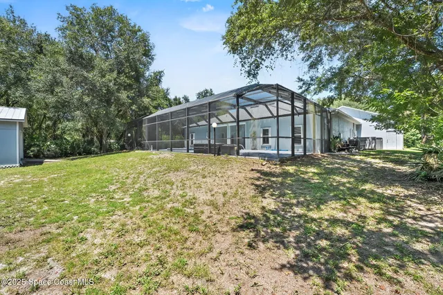 a kitchen with stainless steel appliances granite countertop a stove top oven a refrigerator a sink and a granite counter tops