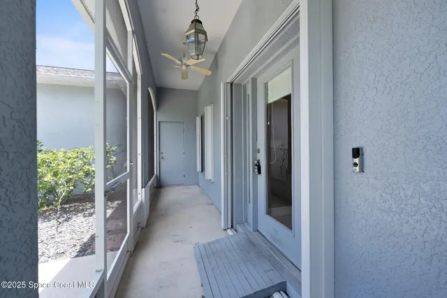 an empty room with wooden floor and window