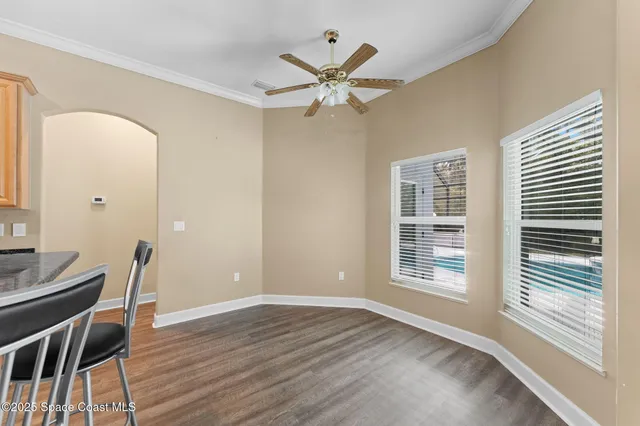 a view of a workspace with wooden floor
