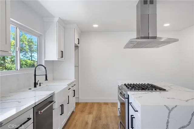 a kitchen with a sink and a window