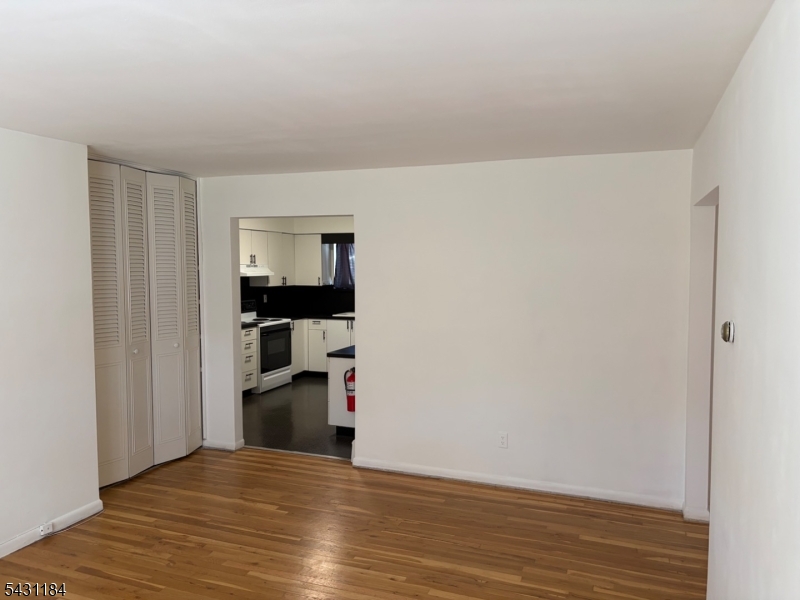 199 North Beverwyck Road Lake Hiawatha, NJ 07034 - Photo 3 of 7 a view of empty room with wooden floor